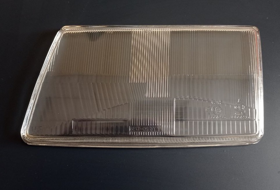 Скло лівої фари на Ауді 100 С3 (Audi 100 C3)  1982-1991