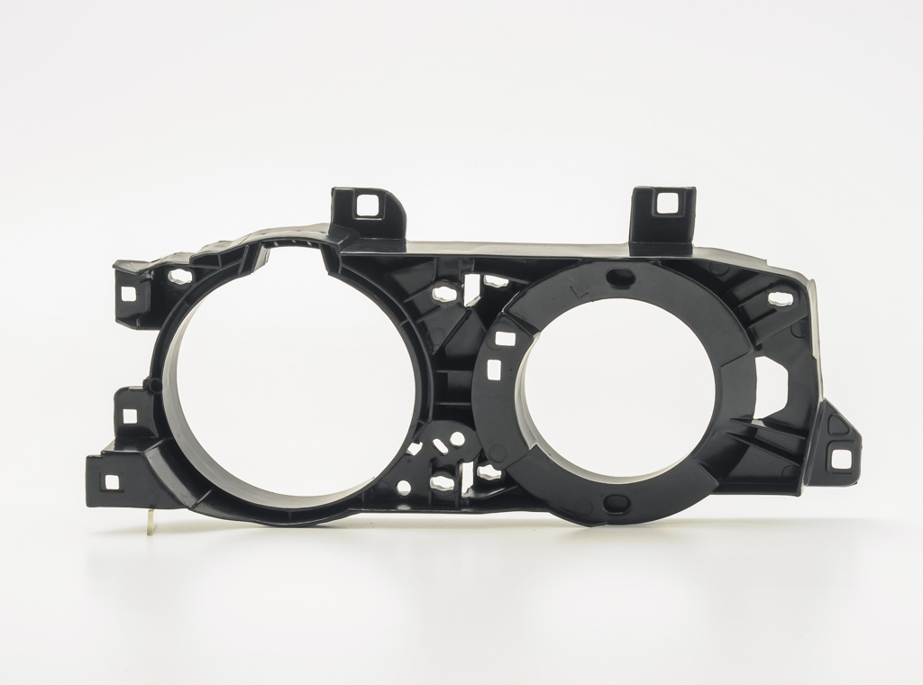 Окуляр (решетка) фари лівої BMW e34