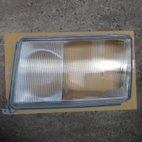 Скло фари лівої Mercedes 124 1990-1993 (світла рамка) 